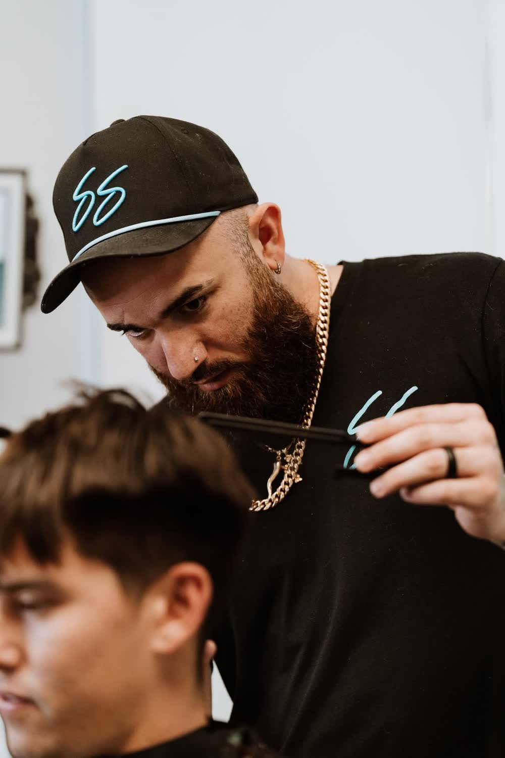 Chris leaning in for detail work on a client cut
