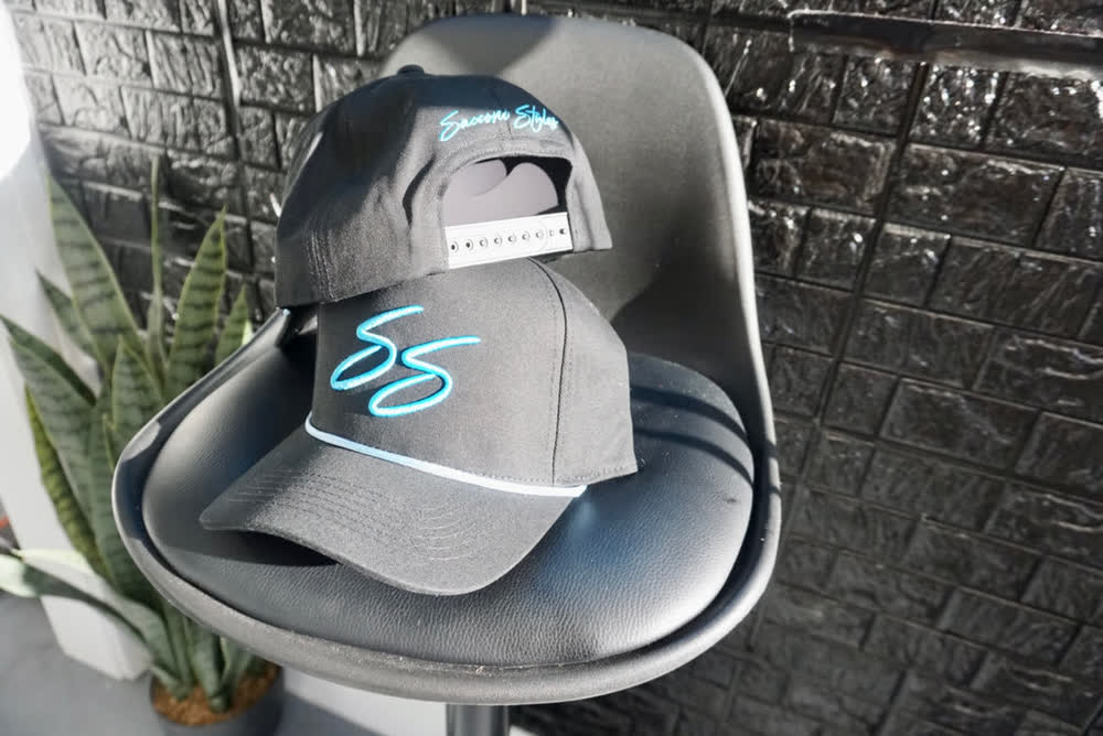 Sacconi Styles snap back hats with the cyan SS script